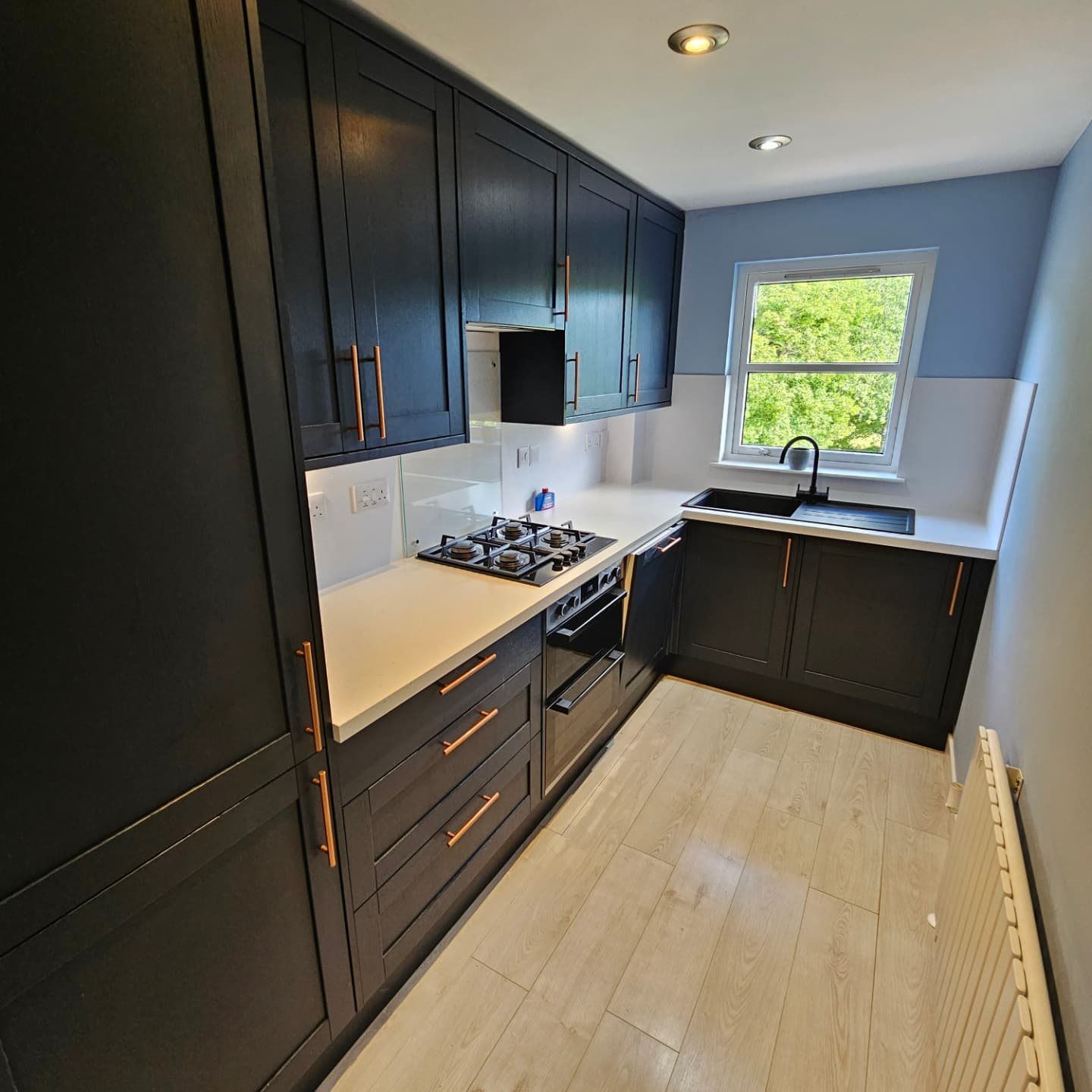 Navy fitted kitchen in a flat in Peterculter